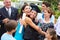 Hispanic Student And Family Celebrating Graduation