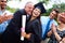 Hispanic Student And Family Celebrating Graduation