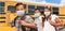 Hispanic Students Near School Bus Wearing Face Masks