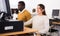 Hispanic woman and african american man studying in computer library