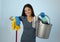 Hispanic woman happy proud as home or hotel maid cleaning and housekeeping holding mop and washing bucket smiling