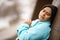 Hispanic Woman Leaning On Wall Praying