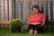 Hispanic Woman Reading Her Bible in Backyard