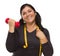 Hispanic Woman with Tape Measure Lifting Dumbbell