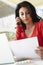 Hispanic Woman Working In Home Office