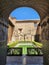 Historic archway into peaceful ancient Spanish courtyard in Royal Palace