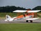 Historic biplane aircraft taxying on runway