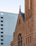 Historic brick Central Presbyterian Church in front of a modern building in Denver