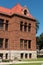 A historic brick courthouse building in Orange County under a blue sky