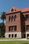 A historic brick courthouse building in Orange County under a blue sky