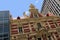 Historic brickwork building amid modern buildings in Adelaide, Australia