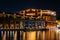 The historic Broadway Pier at night, in Fells Point, Baltimore, Maryland