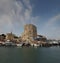 Historic build and port sea boats and clouds