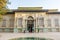 Historic building of green palace Shahvand House of Iranian visitor walking in Sa`dabad palace Complex, built by the Qajar and