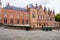 Historic building next to cobblestone street in Bruges