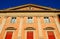 Historic building with red curtains in the city center in Bologna in Emilia Romagna (Italy)