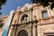 Historic buildings and monuments of Seville, Spain. Architectural details, stone facade.