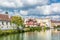 Historic buildings with reflections in water reservoir, Jindrichuv Hradec