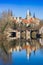 Historic castle and bridge reflecting in the river Saale in Merseburg