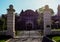 Historic castle, front side. Closed gate and metal fence. in the morning. Sunrays spring weather