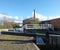 historic castleton mill near armley in leeds and oddy lock gates and footbridge crossing the canal