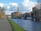 Historic castleton mill near armley in leeds and oddy lock gates and footbridge crossing the canal with moored houseboats