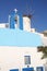 Historic chapel and windmill in Oia, Santorini Island, Greeece