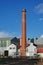 Historic chimney and factory buildings at Thompson Kelly and Lewis engineering facility in Castlemaine, Victoria, Australia