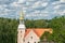 Historic Church. Medieval Cathedral Over Treetops. Woodland View. Lutheran church in Rauna Latvia. Original medieval building was