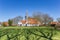 Historic church and white houses in Makkum