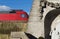 Historic churchyard wall in front of a modern train