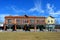 Historic city block with vivid blue sky.