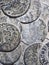 Historic coins of Florence in Italy seen on an outside wall of a church