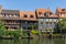 Historic and colorful half-timbered houses on the banks of the Regnitz river in Bamberg in Bavaria