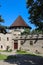 Historic courtyard of ancient castle with watchtower in Little Carpathians, Slovakia
