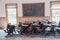 Historic desks in a school classroom with writing on the blackboard in the ghost town of Bannack