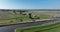 Historic dutch windmills in a farm and grass field landscape in The Netherlands Holland. Famous touristic attraction for