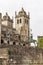 Historic equestrian statue and a bell tower of the Porto Cathedral