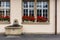 Historic european style wall and windows with flower bed and fountain in Interlaken, Switzerland