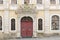 Historic facade with red door