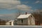 Historic farm buildings in a winter landscape