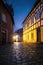 Historic German town at night with stars shining on cobbled street and half timbered ancient houses, AI generative