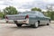 Historic gray vintage Lincoln Continental car parked in a parking lot