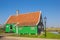 Historic green wooden house in the Zaanse Schans village