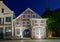 Historic half timbered house in the pedestrian zone in Verden, Germany at night