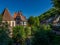 Historic half-timbered houses on the Weiss River in the village center of Kaysersberg