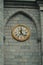 Historic Harmony: Medieval Church and Clock Tower in Lourdes