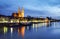 Historic houses, palaces, and churches on the bank of the Danube in the light of sunset