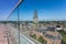 Historic Martini church and tower through the glass screen on top of the modern Forum building in Groningen