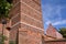 historic medieval defensive walls with a leaning tower in the city of Torun